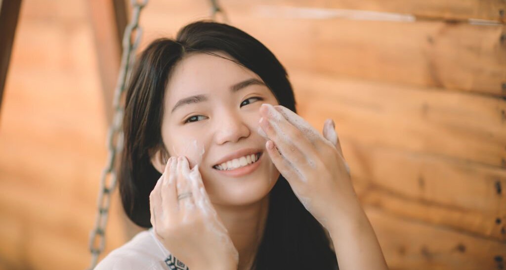 malaysian women using facial cleanser